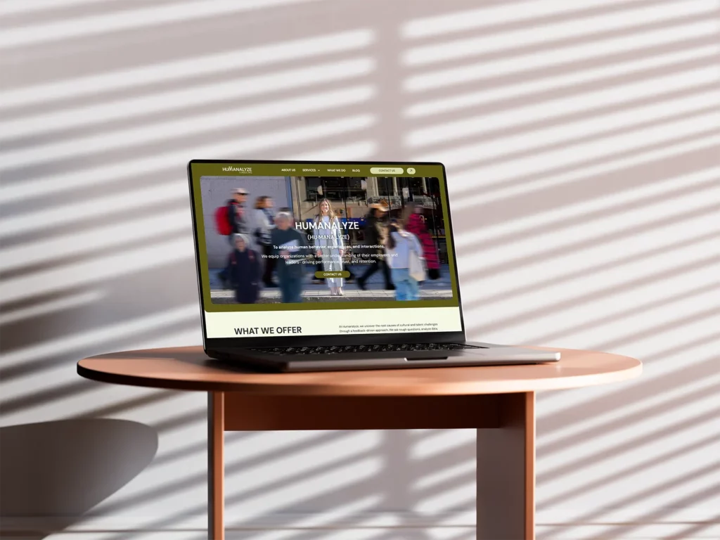 Humanalyze Consulting Mockup on Laptop on top of wooden table