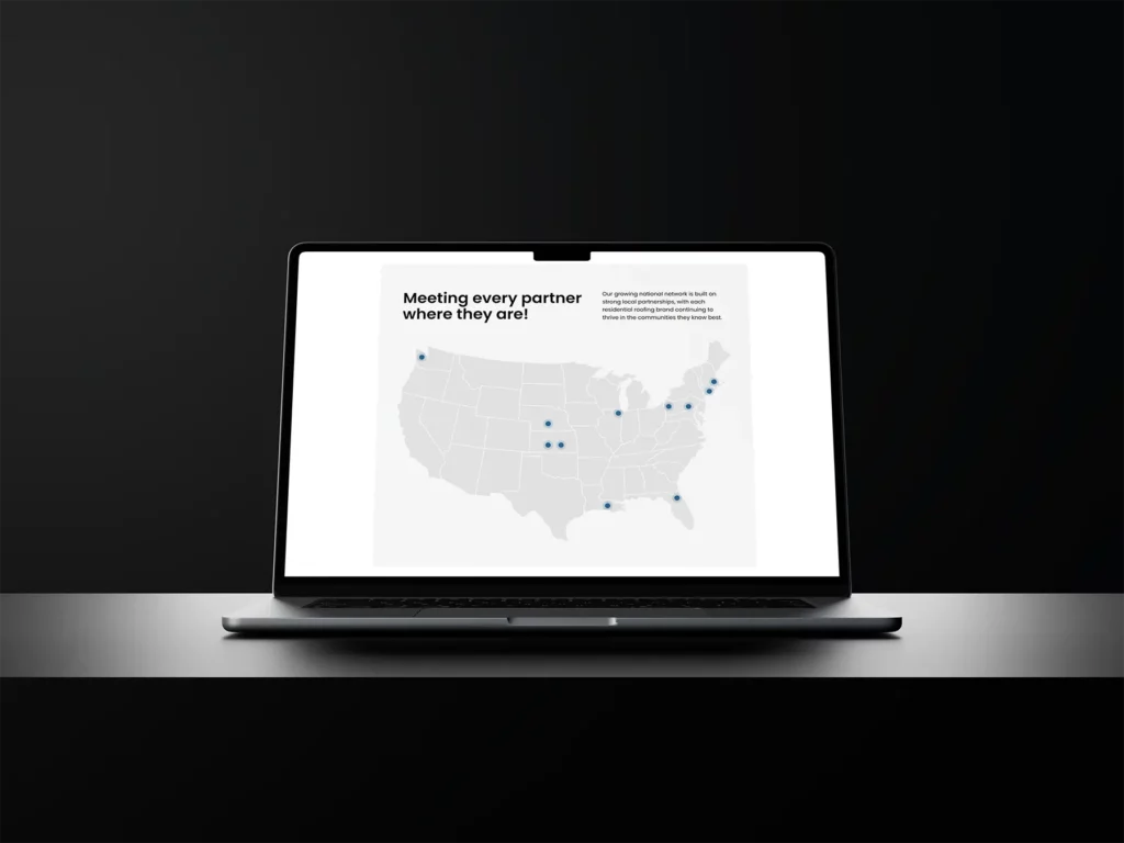 Stonegrove Roofing Partners website partner map on a laptop against a black background