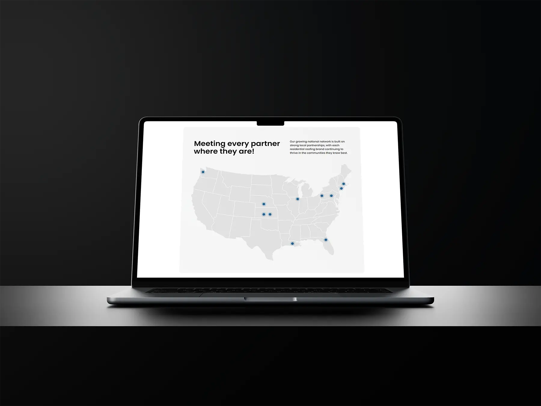 Stonegrove Roofing Partners Mockup on a Macbook on a table in black