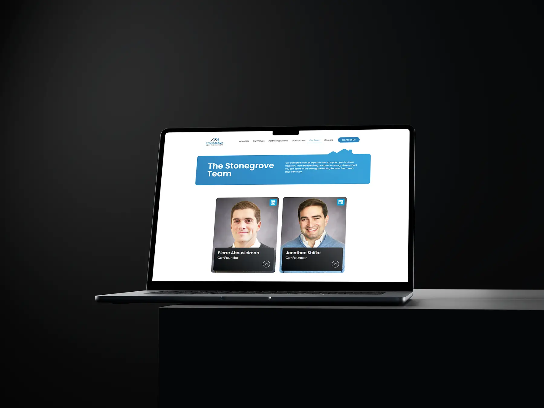 Stonegrove Roofing Partners Mockup on a Macbook on a table in black
