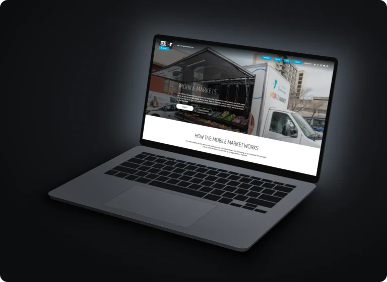 YMCA of Greater Boston Mobile Market page shown on a laptop
